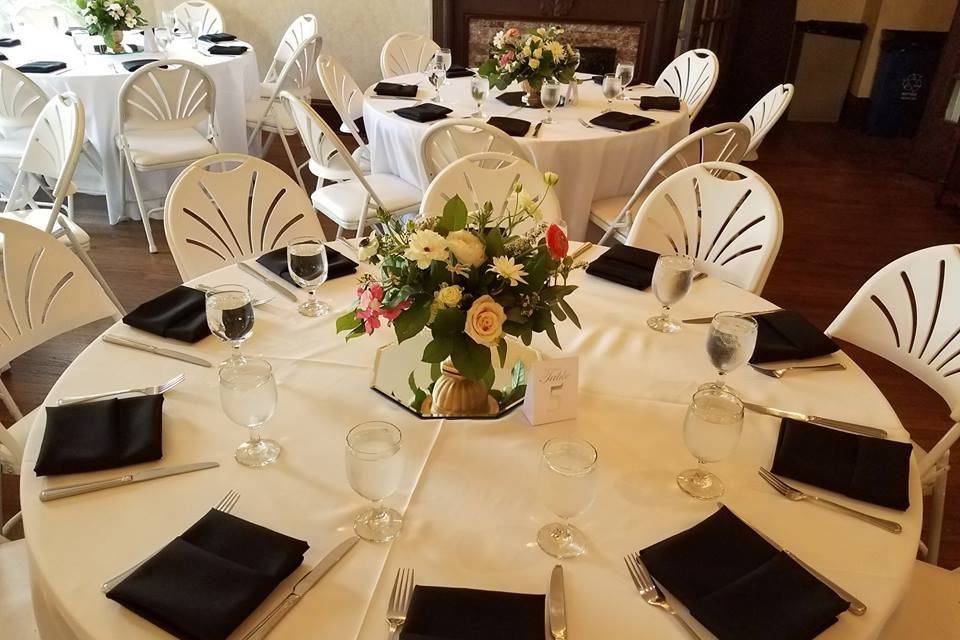 Black napkins and floral centerpiece