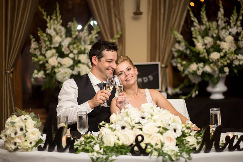 Bride and groom cheersing