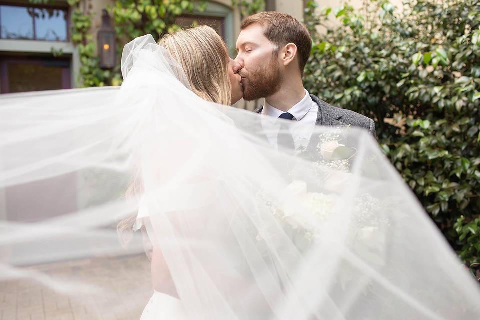 Bride and groom kissing