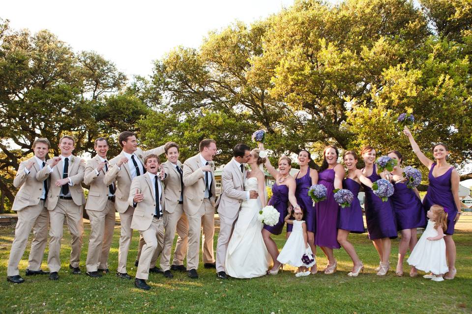 The couple with the bridesmaids and groomsmen