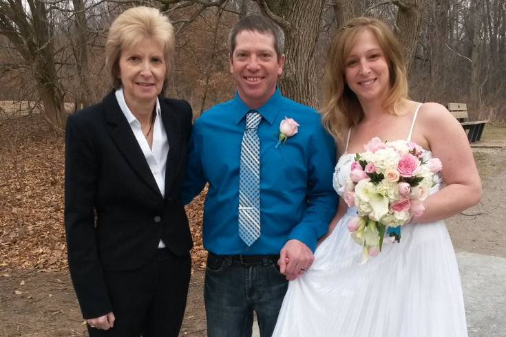 Pastor Deb Helton with the newlyweds