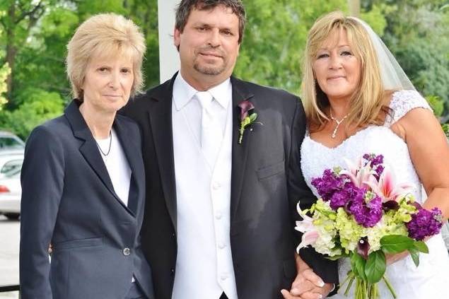 The newlyweds with the officiant