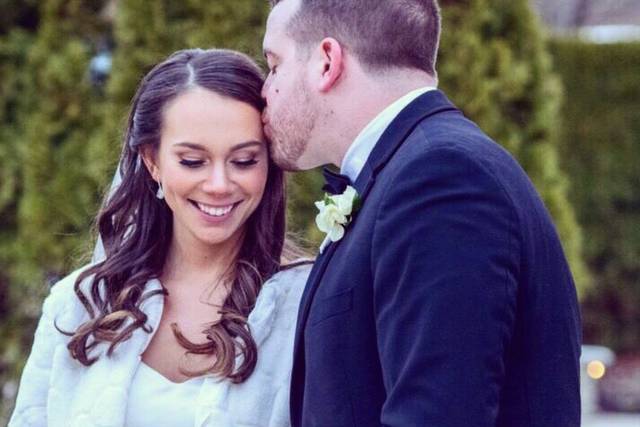 Groom kisses