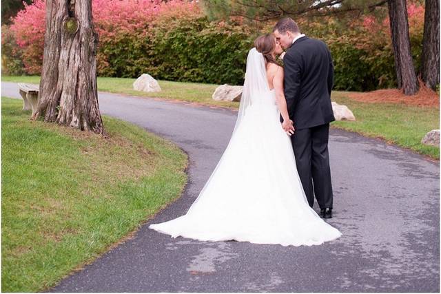 Newlyweds kissing on the road