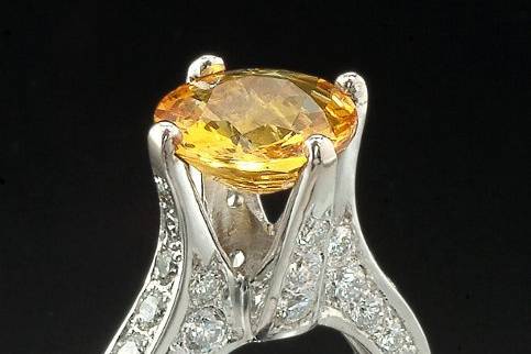 Yellow Sapphire shown in a custom made 18k white gold setting with pave set diamonds.
This setting can be made in 14k white or yellow gold and is suitable for a round center gemstone or diamond