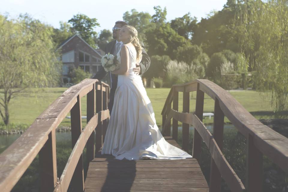 Newlyweds on a bridge