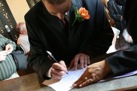 Bride Signs Marriage License