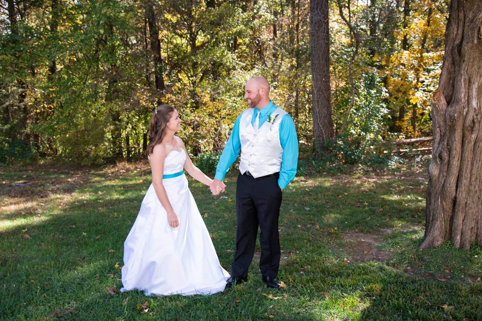 Custom bridal gown and groom's vest and tie