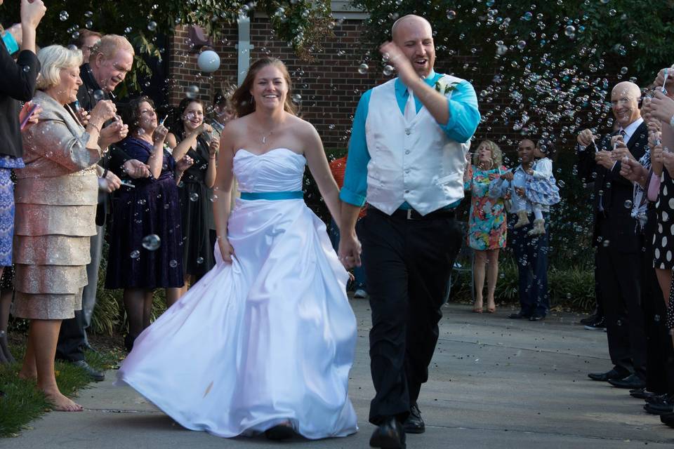 Custom bridal gown and groom's vest and tie