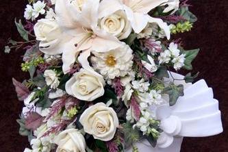 Formal cascade bouquet of high quality, artificial / silk lilies, roses, and zinnias, designed by Something Floral.