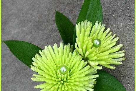 Vibrant and contemporary, lime green/chartreuse groom boutonniere designed by Something Floral.