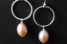 Fresh water earrings with rings in sterling silver. We have a great selections of pearl earring and necklaces that will compliment your style.