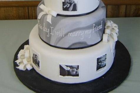 Photos of the happy couple adorn the sides of this unique cake.