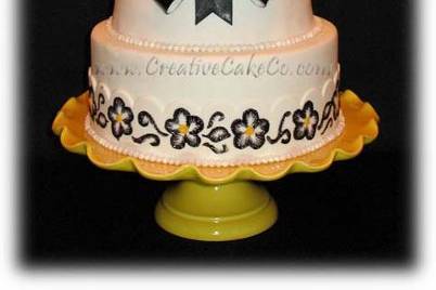 Double carved barrel cake with black bow and brushed embroidery