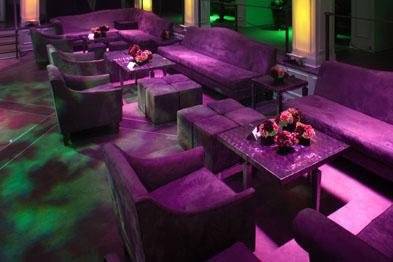 Dramatic Green and Purple uplit lounge