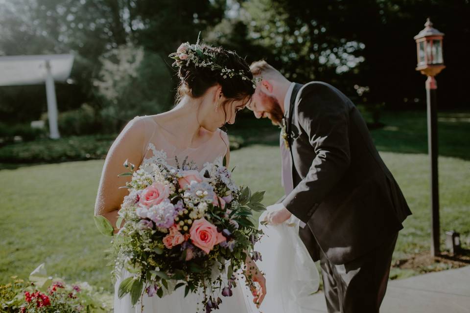 Groom helping bride