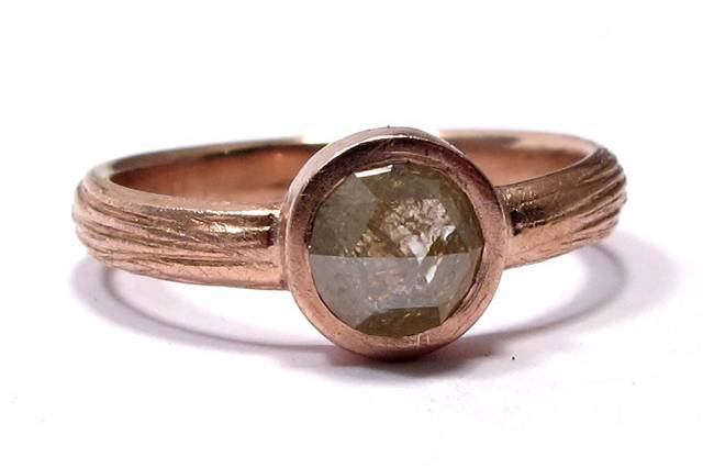 This textured rose gold band features a 1 carat rose cut diamond, slightly yellow and golden in color.