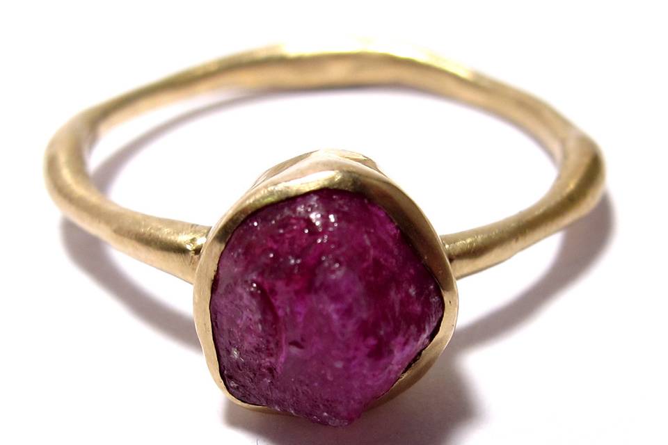 This organically shaped yellow gold band features a 1.2 carat rough ruby. Completely unique.