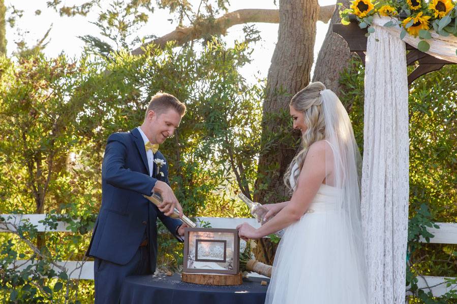 Bride at red horse barn