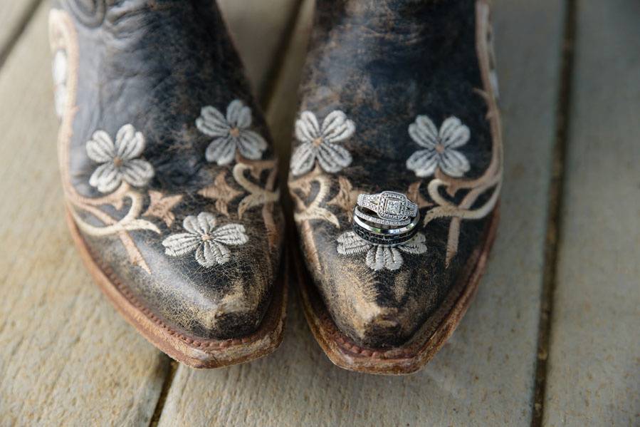 Wedding rings on cowboy boots