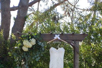 Brides dress hanging archway