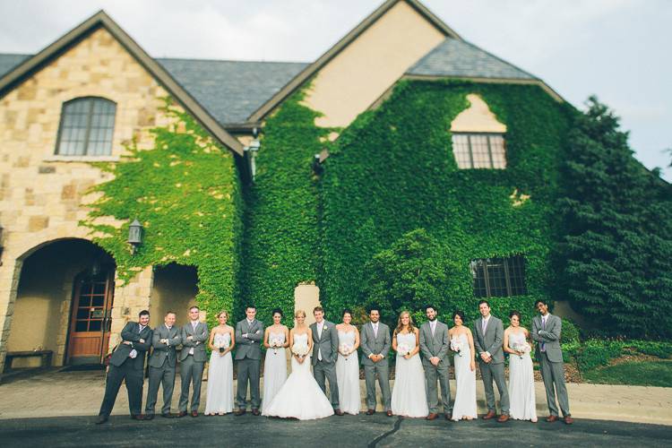 The couple with the bridesmaids and groomsmen