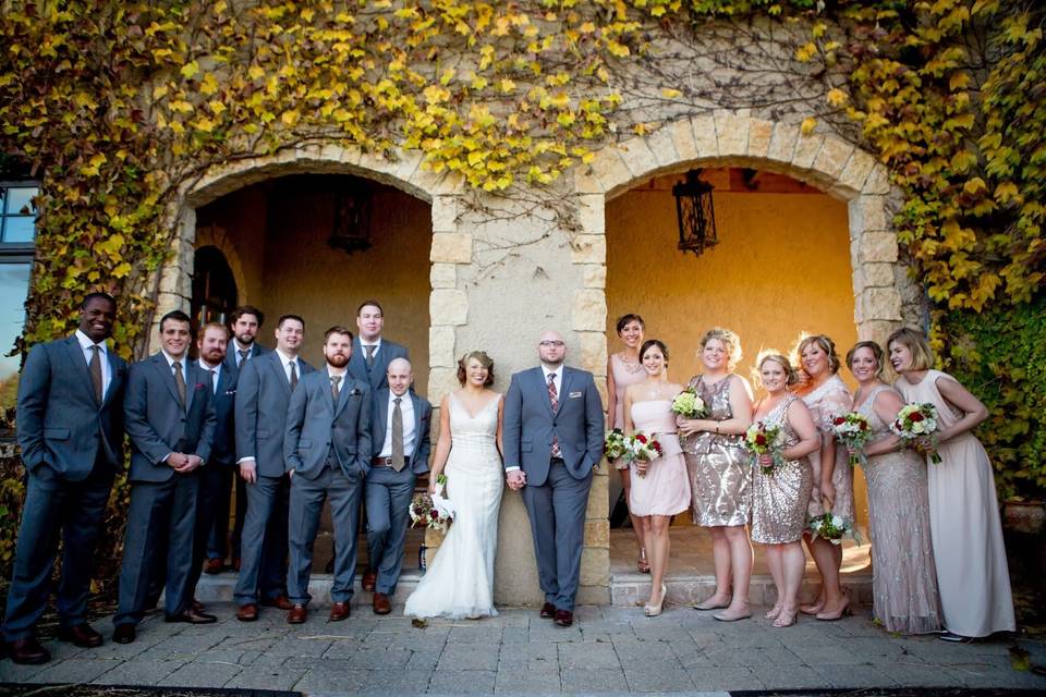 The couple with the bridesmaids and groomsmen