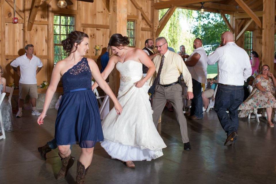Couple dancing with their guests