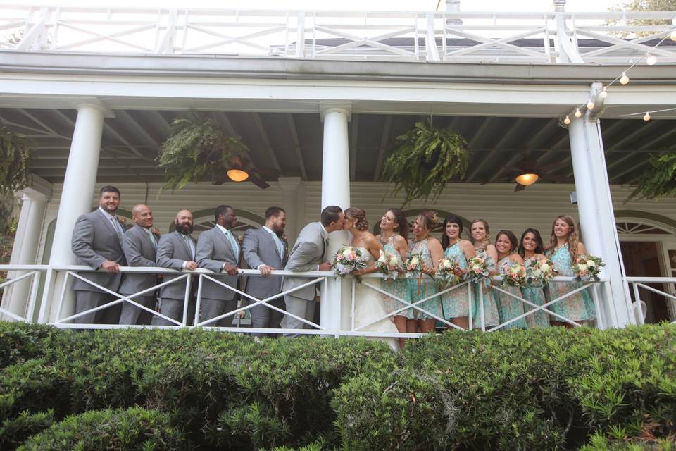 The couple with the bridesmaids and groomsmen