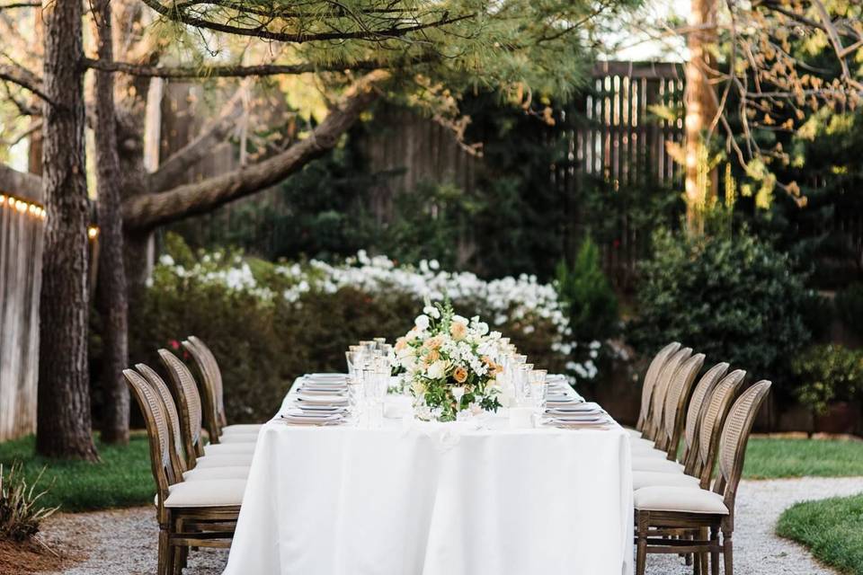 This intimate table set for twelve, styled by Ever Something Events and Floral Design. With chairs provided by