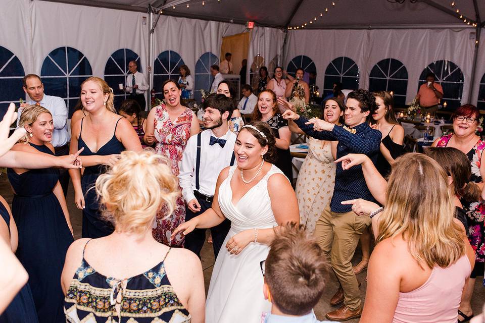 Newlyweds and their guests dancing