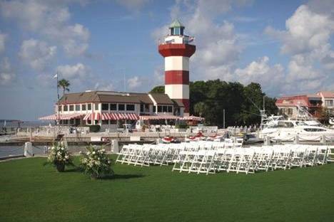 Wedding Ceremony at 18th Green with the Harbor Town Lighthouse in the back ground.