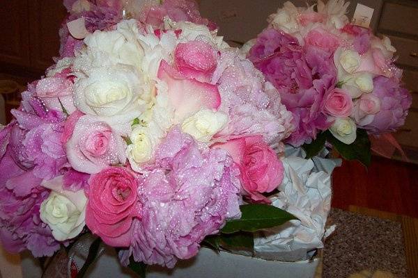 Peony and rose stem style bouquet.  Bouquet was just sprayed with hydrating liquid which gives flowers extra staying power in the heat.