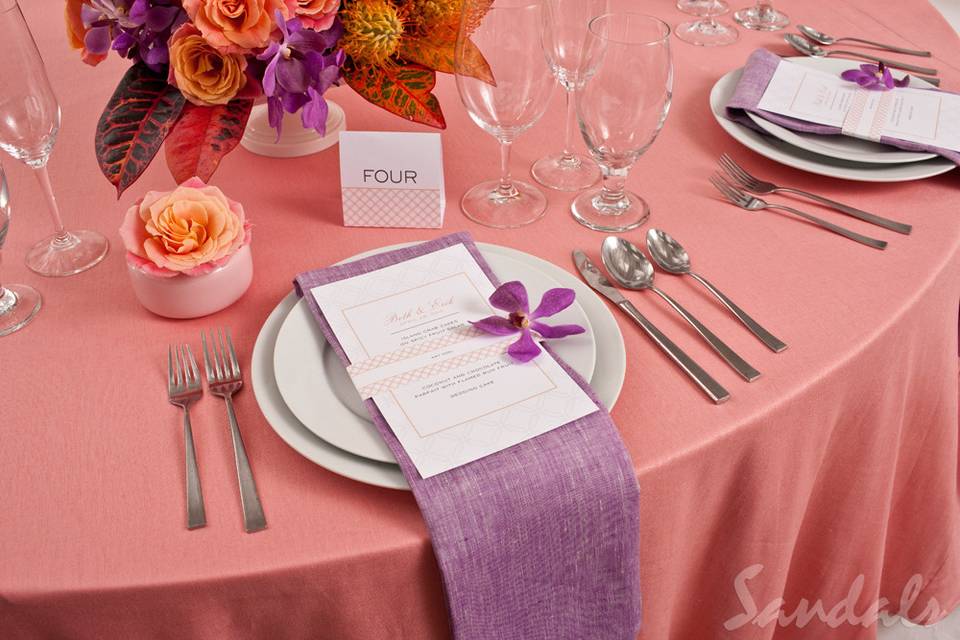 Table setting with pink and purple decor