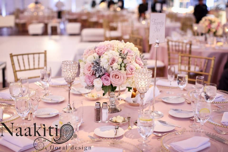 Table setting and pink floral centerpiece