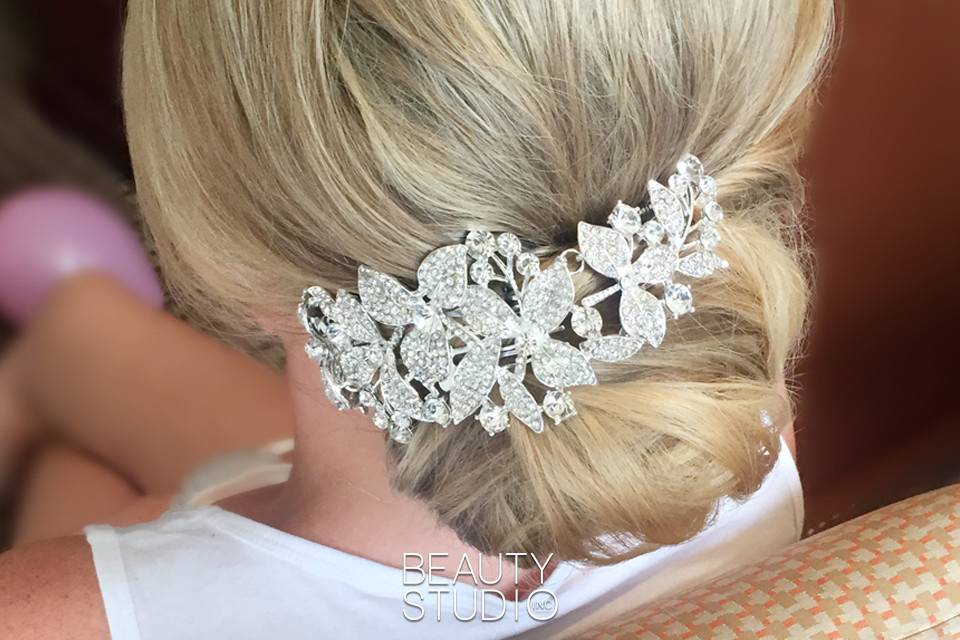 WEdding updo with hair accessory