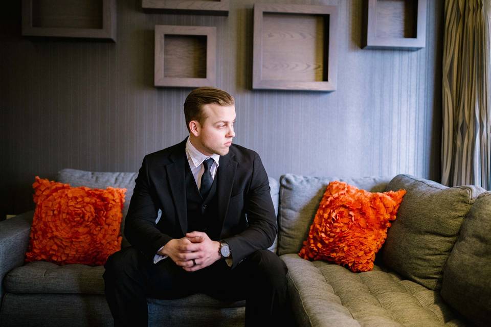 Groom sitting in the lounge area