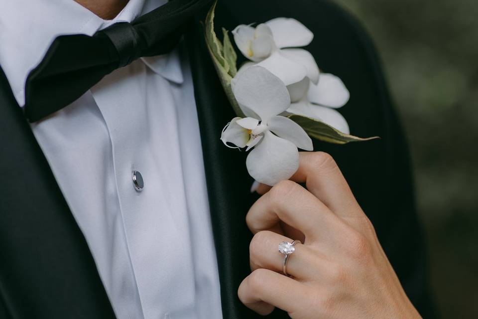 Brides hand on lapel