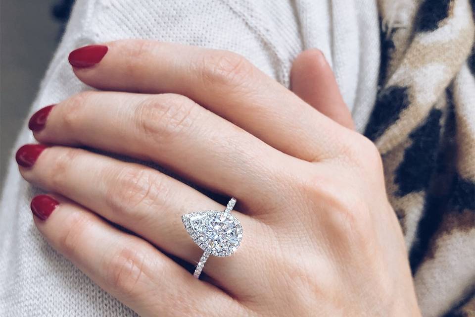 Pear shaped halo diamond ring