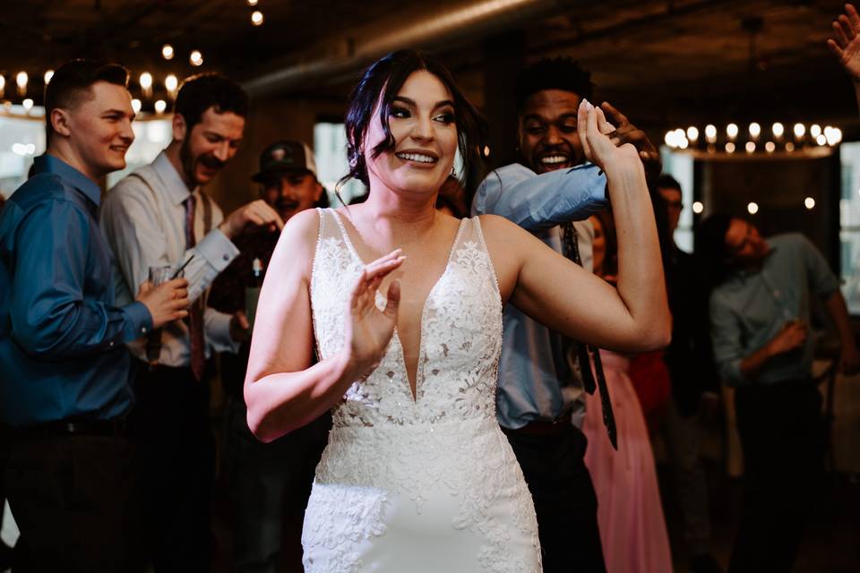 Bride dancing with guests