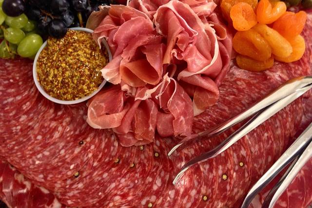 Chef's selection of charcuterie with pickled vegetables and whole grain mustard