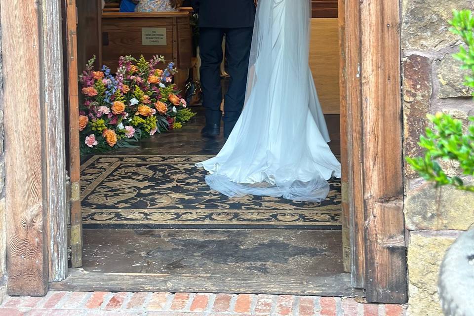 Bride escourted into chapel