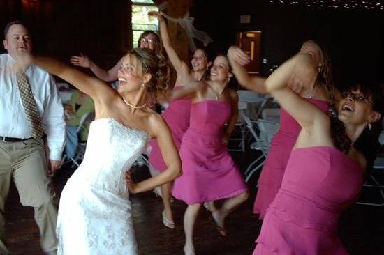 The bride with her bridesmaids dancing