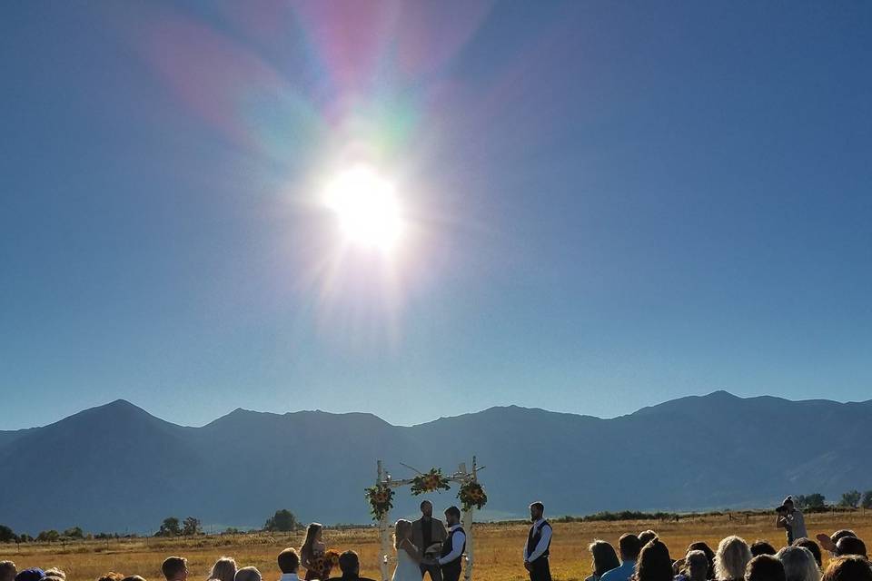 Wedding Ceremony at East Fork Ranch in a field