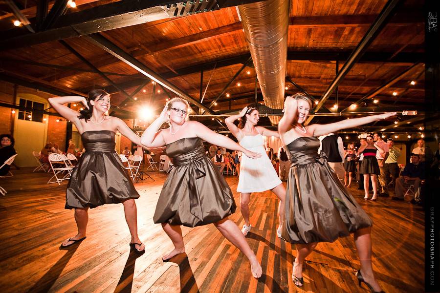 Dancing bride and bridesmaids