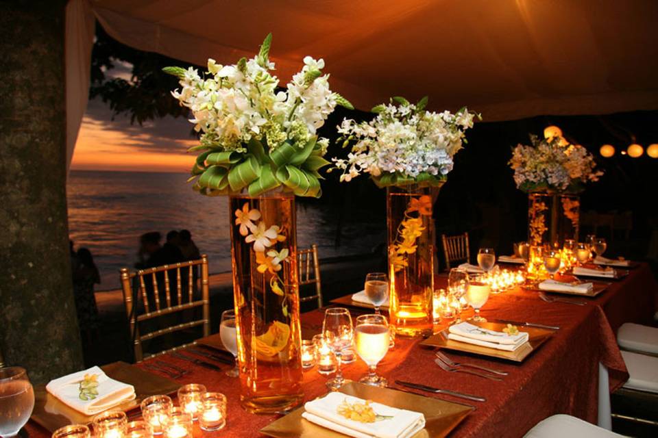 Table setup with candle and floral centerpiece