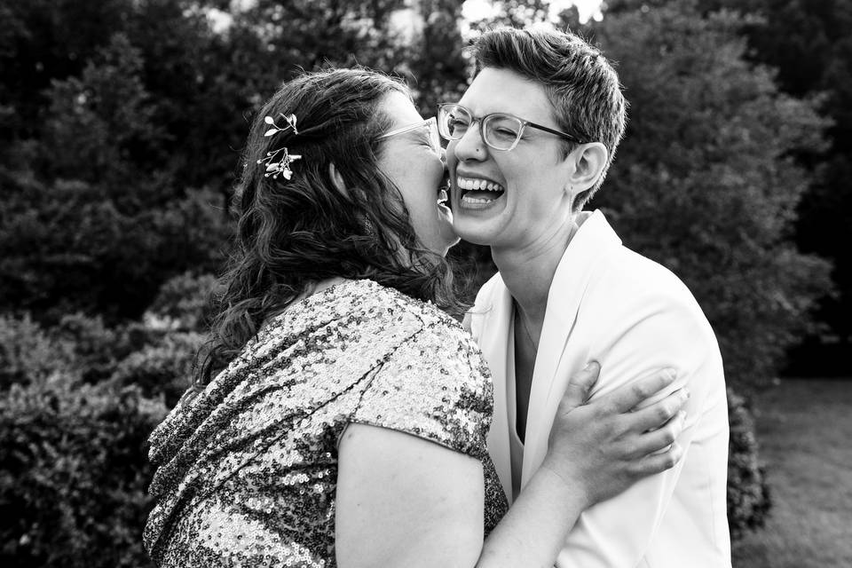 Two brides laugh