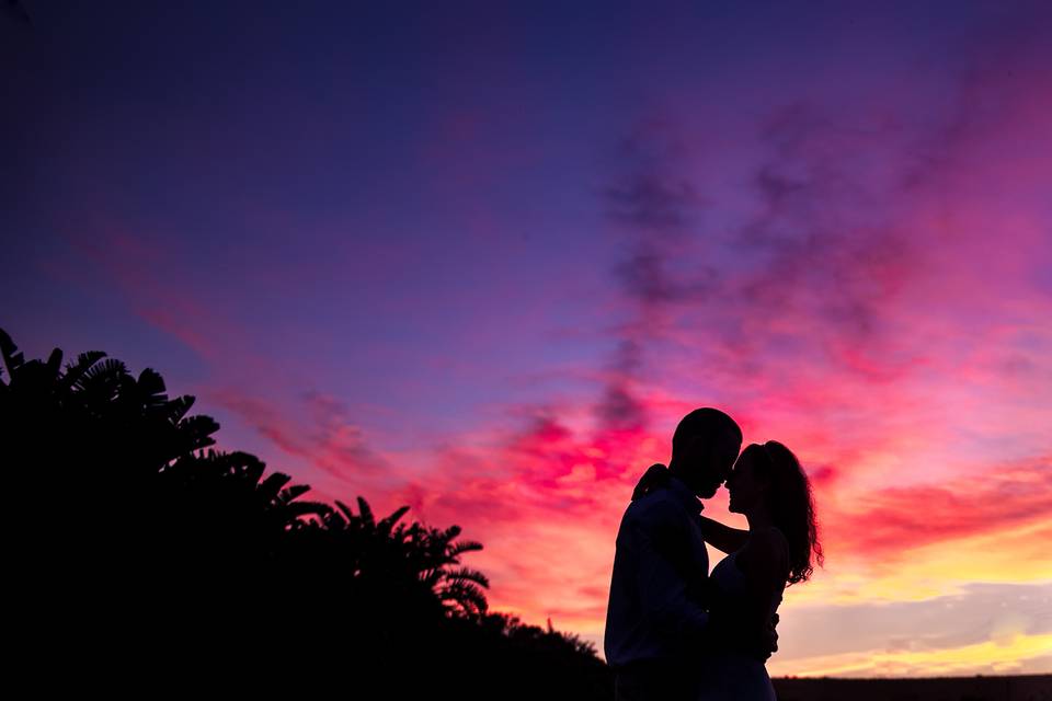 Couple silhouetted at sunset