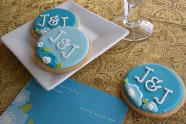Cookies customized with the bride and groom's initials, to match the wedding shower invitation.