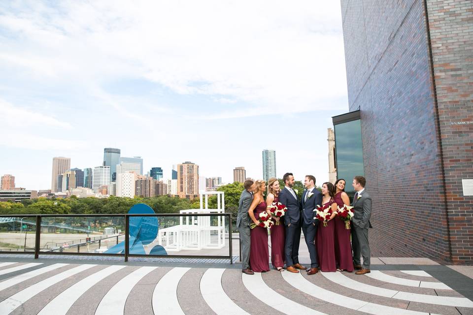 Couple with bridesmaids and groomsmen on the terrace